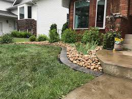 Jun 10, 2014 · the sand bed that you lay over landscape fabric keeps most grass types from sending roots under the edging and getting into the garden. Curb Appeal And Deck Ideas That Ll Increase Home Value
