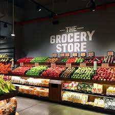 an independent grocery store with their very own cafe right beside it find affordable produce in the gr grocery store design vegetable shop supermarket design