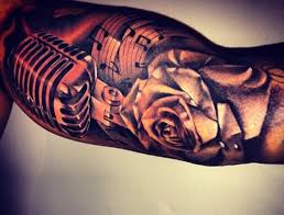 A great design with a music note inside. 27 Microphone And Headphone Tattoos