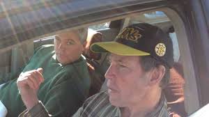 Men rescued after clinging to boat for 14 hours