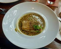 Spread the courgettes, onions and peppers on the sheet pan and drizzle with the olive oil marinade. Pan Fried Seabass Ras El Hanout Spiced Israeli Couscous Picture Of Bread Street Kitchen Singapore Tripadvisor