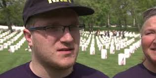 Amazing:" Volunteers honor veterans by placing thousands of flags at Wood  National Cemetery
