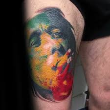 It's almost flawless, from the blue splash above, the fierce lion's rex manning mane, down to the shadow effects joining the tree and ground. 60 Bob Marley Tattoos For Men Jamaican Design Ideas