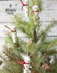 When i was a little, every christmas my mom would pull out an orchestra of wooden angels with green spotted wings, golden instruments, and b. Easy Diy Wooden Peg Snowman Christmas Tree Ornaments Organized Clutter