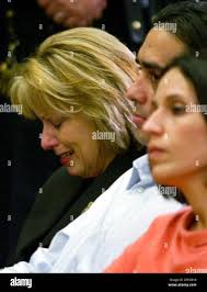 Sharon Rocha, Laci Peterson's mother, left, Brent Rocha and his wife Rose  Marie Rocha, right, are seen during a news conference after the verdict in  Redwood City, Calif., Monday, Dec. 13, 2004.