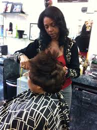 Jamaica, kingston city, hairdresser and clients in hair salon. Local Hair Salons