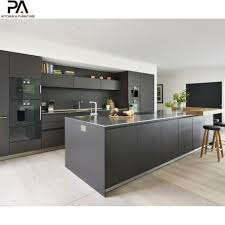 Neutral colored countertops and wooden open shelving keep this kitchen feeling natural. China Modular Kitchen Island Style Black Lacquer Kitchen Cabinets China Kitchen Cabinets Kitchen Furniture