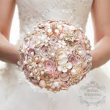 My bouquet had a king protea in the centre, surrounded by beautiful cream and soft pink roses, and tied together with an ivory ribbon. Rose Gold Wedding Bouquet Blush Pink Ivory Cream Brooch Etsy