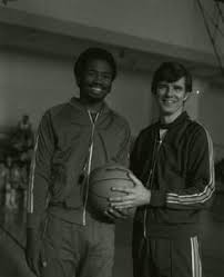 Suffolk University men's basketball coach James E. Nelson with a player,  1979-1980