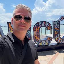 When should you press the button to signal the bus driver to stop at the  next stop?