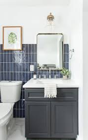 For more eclectic bathroom style ideas check out this the dark accent wall tile and wood vanity cabinet add some subtle texture and interest. 75 Beautiful Ceramic Tile Powder Room Pictures Ideas May 2021 Houzz