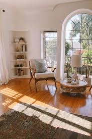 Sun Drenched Living Room Bright White Walls And A Vintage Rug Keep The Decor Impactful And Min Home Decor Bright Living Room Decor Interior Design Living Room