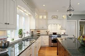 white kitchen cabinets green granite
