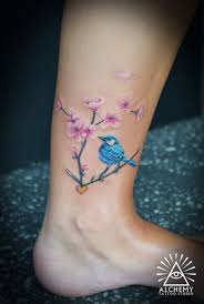 Cute Bird And Flower Branch Tattoos On Ankle Jpg 500 742 Bird Tattoo Wrist Blossom Tattoo Foot Tattoos