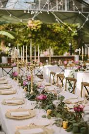 A Flower Filled Spring Wedding In Michigan Long Table Wedding Wedding Table Centerpieces Candelabra Wedding Centerpieces