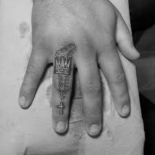 Head piece on a head piece. Colored Finger Tattoo Of Crown With Cross Tattooimages Biz