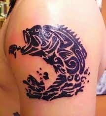 The strokes show the angry side of the bear with its claws raised to attack. Tribal Bass Tattoo Tattoos Skull Tattoo Tribal Tattoos