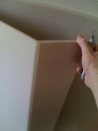 Ferguson describes his process for hanging drywall on a gable end. How To Cut Drywall
