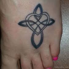 As a result, it's a popular wedding tattoo for men. Cross Heart Tattoos