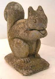 It's hard to keep a shade garden in color at all, let alone all season unless you cheat a little and use colorful ornaments or chairs like these. Vintage Belgian Cast Stone Squirrel Garden Ornament At 1stdibs