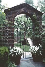 This garden arch will look beautiful all year long, whether covered in roses, vines, flowering climbers assembly required. Brick Arched Garden Entry With Wrought Iron Gate Traditional Landscape Dc Metro By Dc Design Llc Houzz