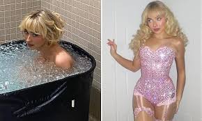 Sabrina Carpenter strips naked and takes a dip in an ice bath as ...