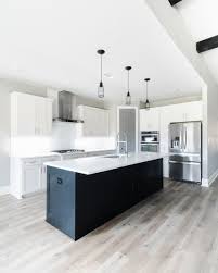Modern Industrial White Kitchen With Black Island White Modern Kitchen Interior Design Kitchen Black Kitchen Island