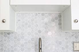 For a punchy, dramatic effect, use black tiles. How To Install A Marble Hexagon Tile Backsplash Abby Lawson