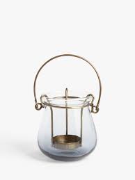 Hurricane lamps, whether electric or for a candle, can add interest to a side table, coffee table, shelf, or side table. Hurricane Lamps John Lewis Partners