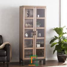 Meja kayu yang masih kasar ini ternyata bisa bikin ruang tamu kamu makin hidup, jadi makin betah ngobrol sambil ngopi nih. Jual Lemari Hias Ruang Tamu Pintu Kaca Finishing Coklat Modern