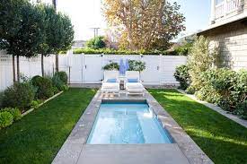 The pool is the focal point of this small yard, with water features and lounge seating creating a peaceful, relaxing atmosphere. Spruce Up Your Small Backyard With A Swimming Pool 19 Design Ideas