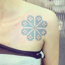Colorful cross stitch television tattoo design for arm. 27 Amazing Cross Stitch Tattoo Designs Tattooblend