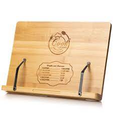 This cookbook holder will match well with bamboo cutting boards and utensils in the kitchen. if you own a bamboo cutting board or a few light wood utensils, this cookbook holder will match well with your style. Cookbook Stand By Chef S Dream Engraved Bamboo Book Holder With Adjustable 6 Height Positions Backing Recipe