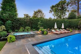 We like the idea of 'fresh' water for every soak, but realize that it would take a lot of hot water each time. Slate Tiled Hot Tub Design Ideas