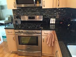 Neither one looked green at all, and white this time i ended up going with azul platino for a lighter look on the perimeter cabinets (also. We Installed Natural Quartersawn Maple Cabinets With Uba Tuba Granite Mosaic Tile Backspla Trendy Kitchen Tile Maple Kitchen Cabinets Kitchen Tiles Backsplash