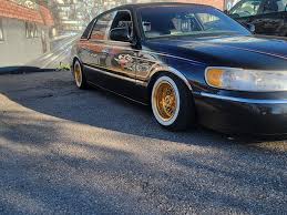 Image result for Medium Gold 1998 Town Car