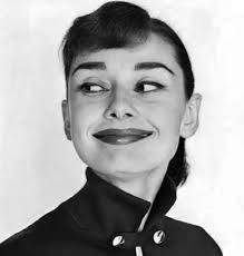 The shot with Audrey Hepburn was taken during the filming of Funny Face,  which is very, very loosely based