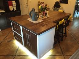 A table provides you with a movable kitchen island, so you can rearrange the space when you need to, which is helpful in a small space. Custom Made Kitchen Island Dining Table By Insight Woodworking Llc Custommade Com