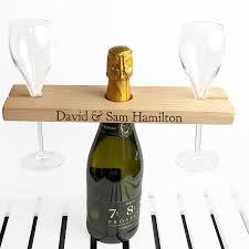 You can place champagne glasses, cocktail glasses, or burgundy glasses on this glass holder. Personalised Welsh Ash Champagne Holder By The Little Boys Room Notonthehighstreet Com