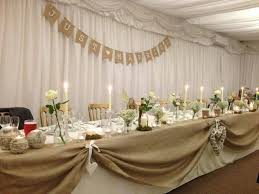 Top Table Burlap Swags With Lace Bows Instead For You Bridal Table Decorations Bridal Party Tables Rustic Wedding Table Decor