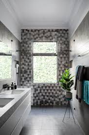 Look at the photo ideas below to get inspired and motivated to create your own dream bathroom in gray and white hues. Matte Black Accents Add Sophistication To This Grey And White Bathroom