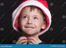 Boy in Santa Claus hat stock photo. Image of smiles, cheeky
