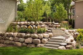 Boulder Wall Landscaping In Minneapolis Mn Southview Design In 2020 Rock Wall Landscape Large Backyard Landscaping Landscaping Retaining Walls