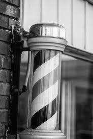 Those rotating red, white, and blue poles outside barbershops have become an icon. Black And White Photo Of An Old Fashioned Barber Shop Sign Keith Dotson Photography