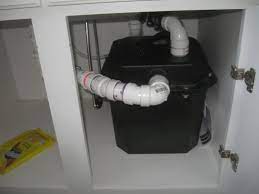 The pump sits beneath and next to the sink in the corner, and is pumps up and into the house waste plumbing. Basement Kitchen Sink Pump Plugged Into Gfci Plumbing Inspections Internachi Forum