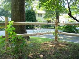 Scarecrow, pumpkins, split rail fence, wheelbarrow, gardening tools, fall leaves. Wood Post And Rail Fencing In Collegeville Pa Paramount Fencing Inc