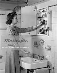 Check spelling or type a new query. 1940s Woman Reaching Into Bathroom Medicine Cabinet Stock Photos Bathroom Medicine Cabinet Craftsman Style Bathroom Mirror Cabinets