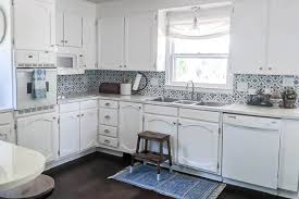 How to paint the honey oak cabinets and island and extensive trim in our kitchen for a more updated style that matches our light and white french country. Painting Oak Cabinets White An Amazing Transformation Lovely Etc