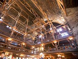 The old faithful inn's chalet features applied to its log skeleton typify the rustic style. Old Faithful Inn Yellowstone National Park United States Wyoming Afar