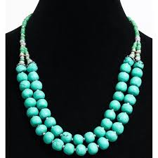 The name turquoise comes from the french term pierre turquoise which means turkish stone in light of the fact that trading exchange routes that brought turquoise to europe from the mines in focal asia pass by turkey, and venetian dealers frequently obtained the stone in turkish bazaars. Ethnic Artisanal Necklace Two Rows Imitation Round Turquoise Stones Arranged With Green And Silver Beads